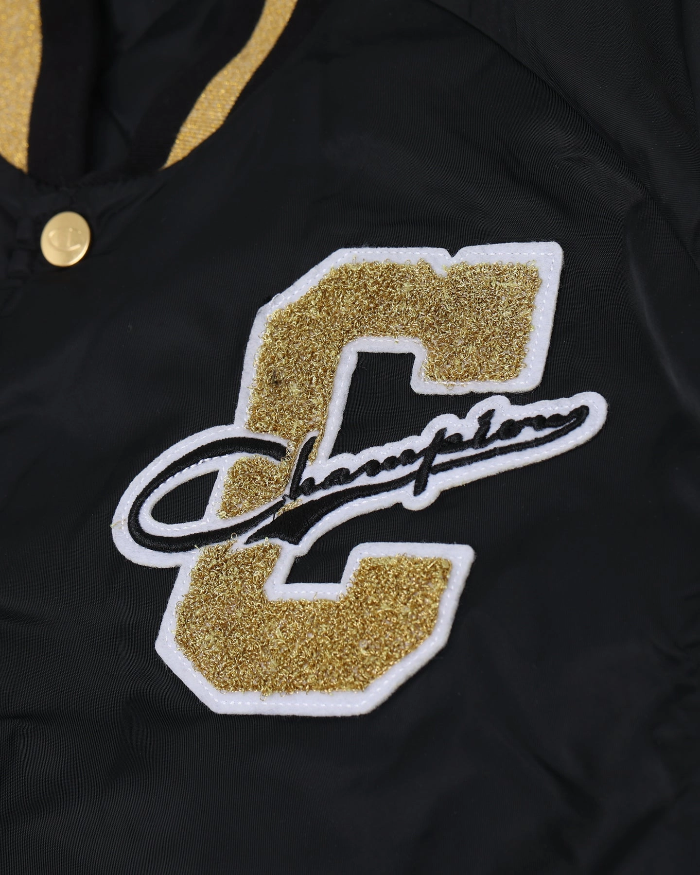 Champion LFS Letterman Jacket Black/Gold Commuter Fit suitable for beach vacations