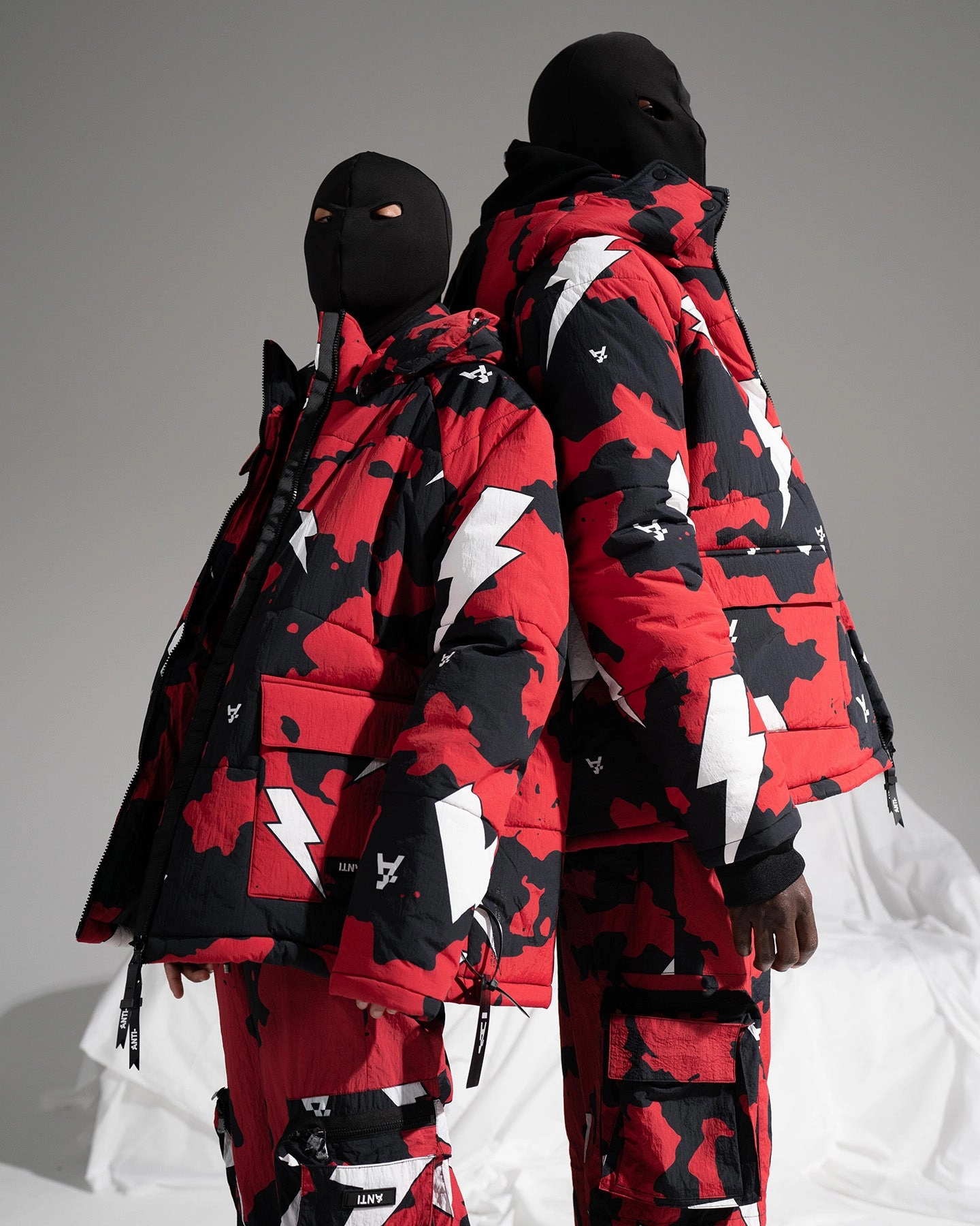 Essential Warmth The Anti Order Storm Camo Puffer Jacket Black/Red/White