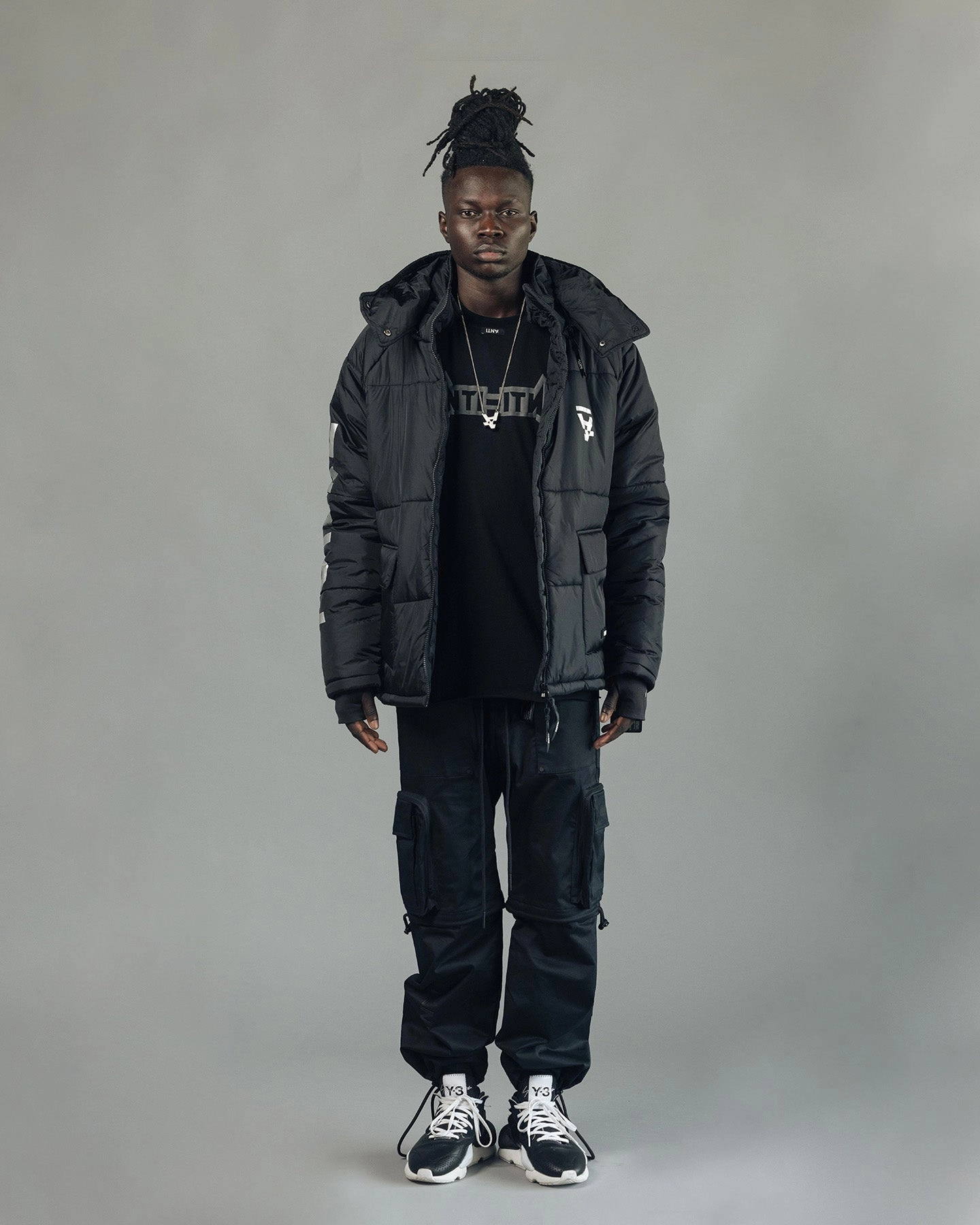 The Anti Order Hyphen ATD Puffer Jacket V2 Black/Silver Algorithm Button Closure